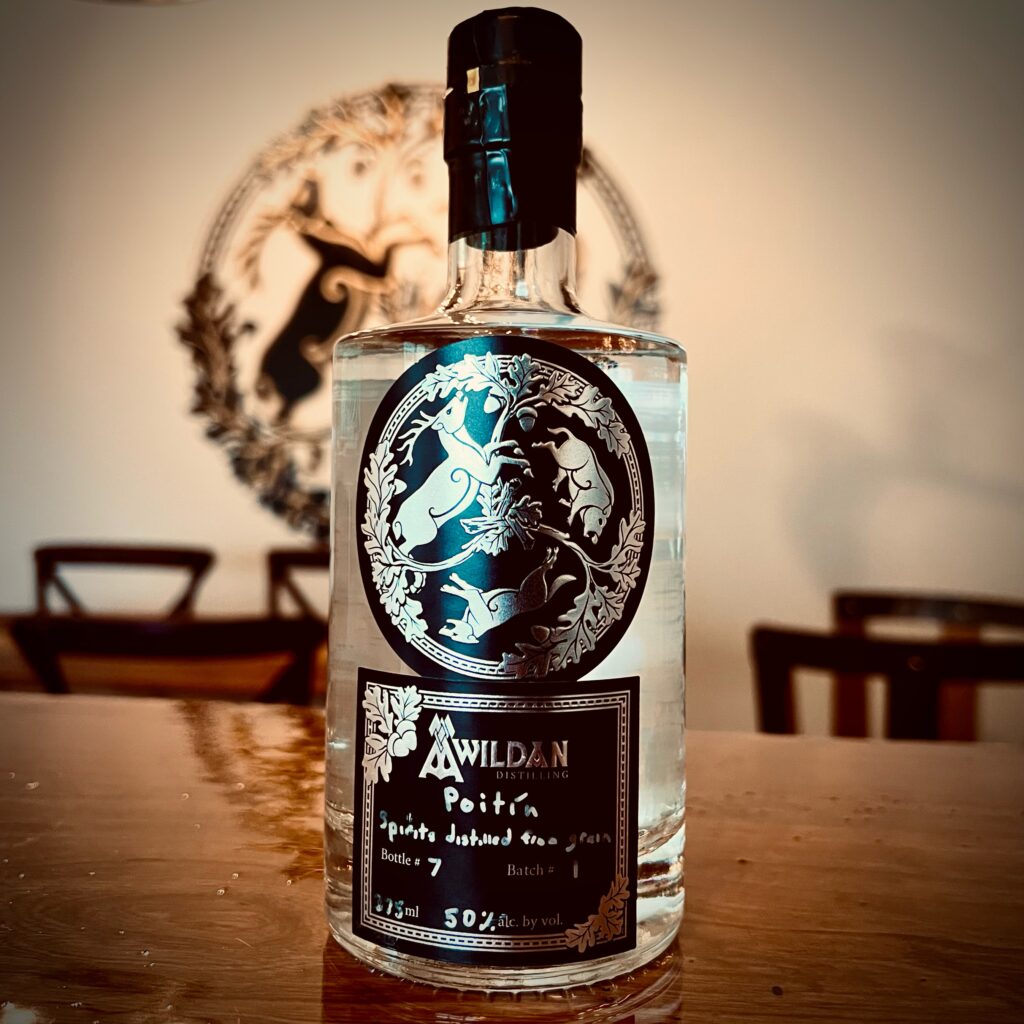 375ml bottle of Poitin sitting on Awildan's tasting room bar.
